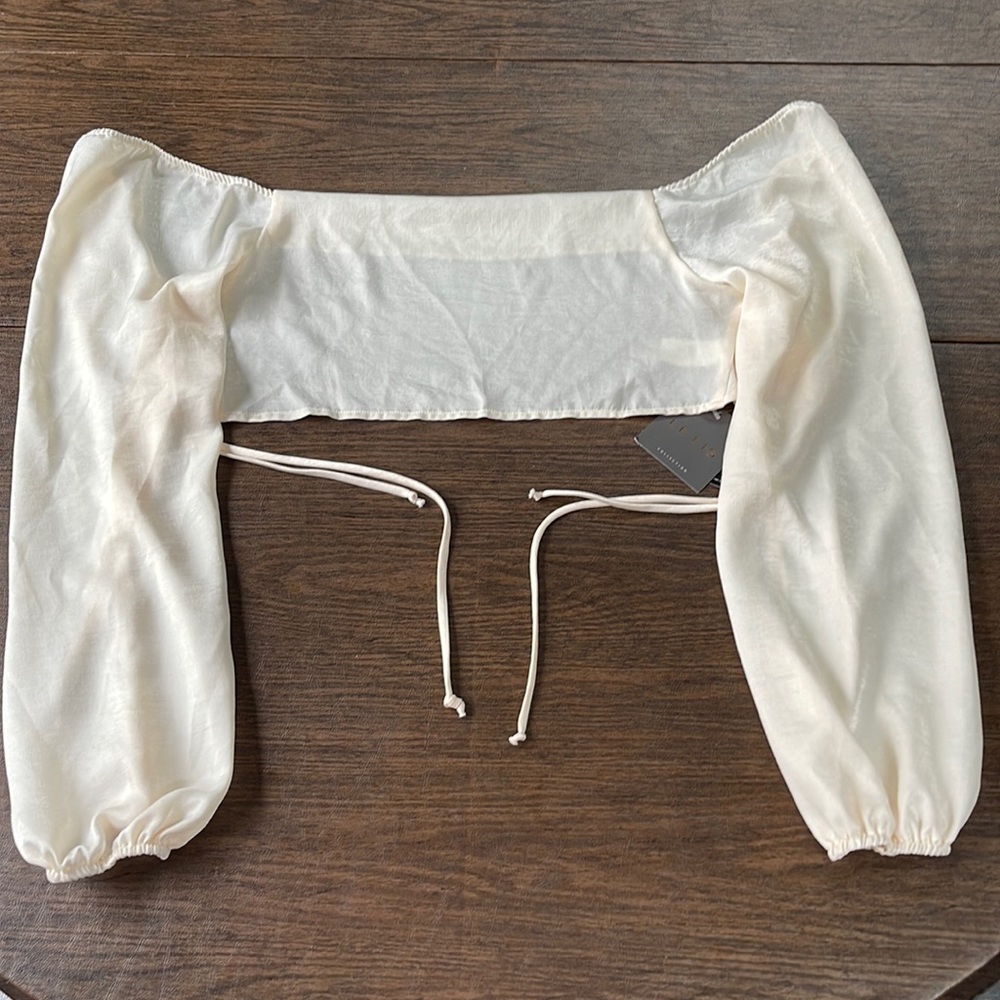 Le Lis Long Sleeve Open Tie Back Crop Top in Cream
